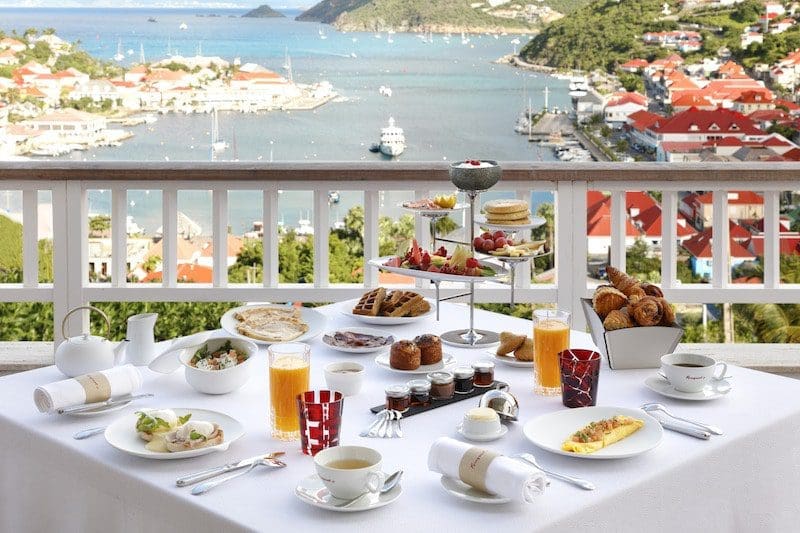 breakfast white tablecloth overlooking water in st. barth 
