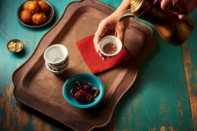 arabic coffee with dates and chocolate flat lay - East End Taste Magazine