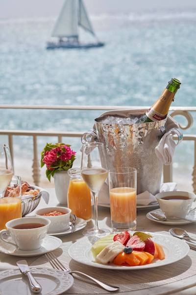 champagne breakfast deck patio overlooking water sailboat