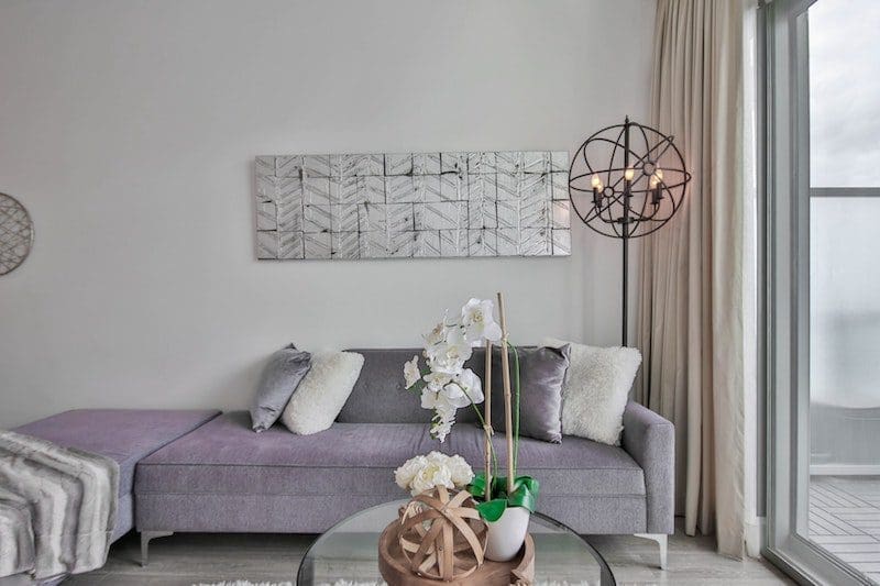 living room with sliding glass door purple sofa luxury Hamptons