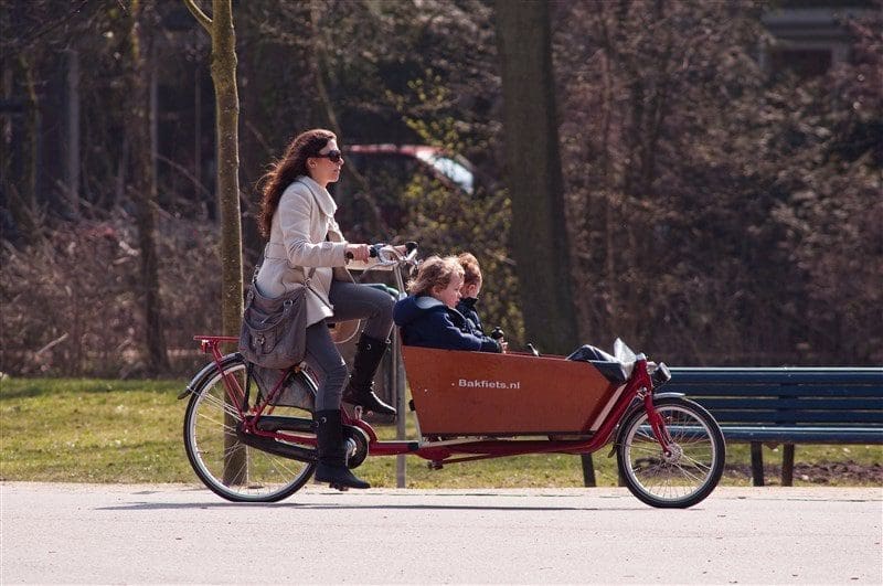 Women and children biking in Amsterdam