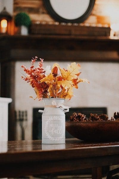 festive holiday decor home autumn leaves in white vase