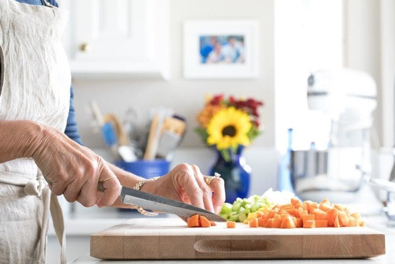 cooking prep work in beautiful white kitchen