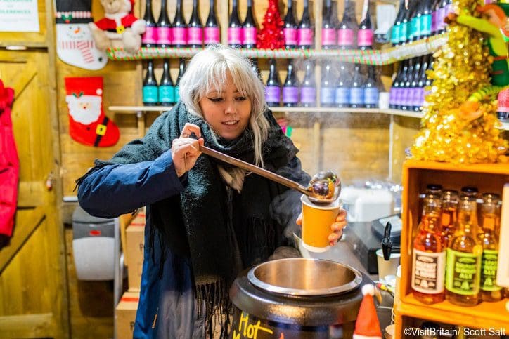 woman serving cider at glasgow christmas market