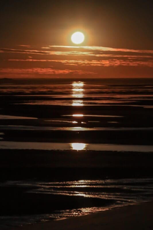 beautiful sunset coastline dark water