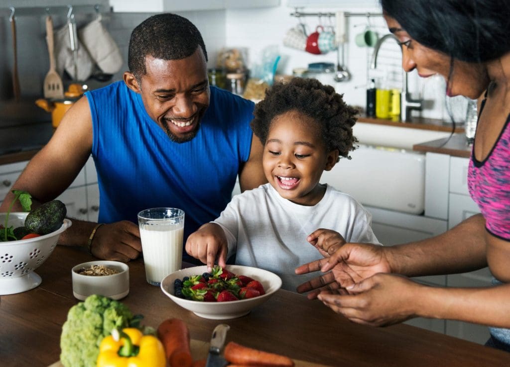 family cooking healthy food at home