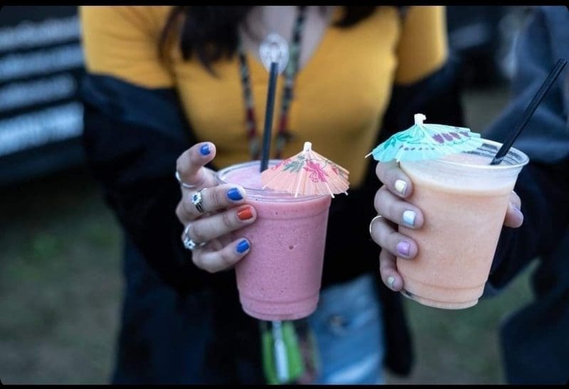 women holding frozen margaritas