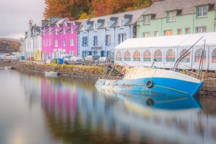 A submerged fishing boat in the harbour at high tide