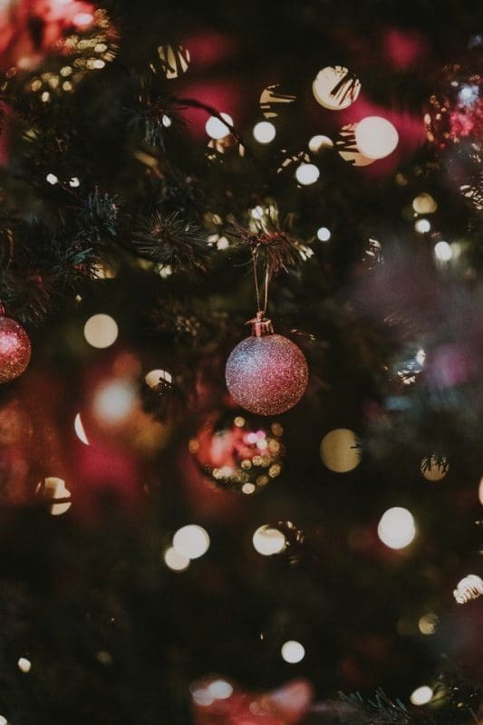 christmas ornaments lit up in the evening cozy