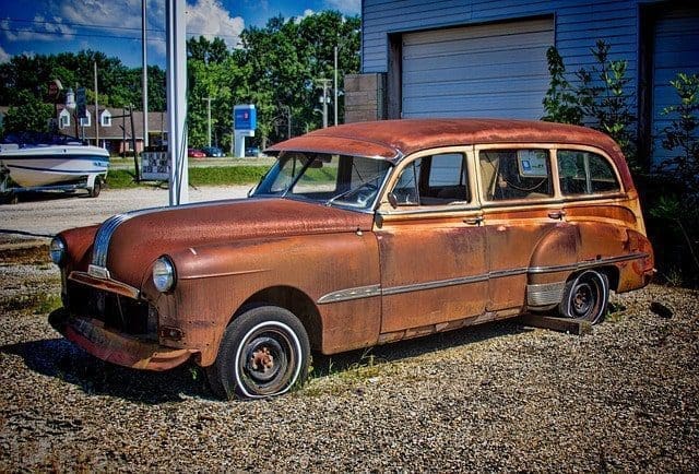 old rusty red car