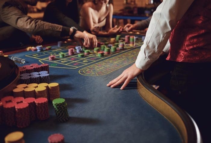 People gambling at roulette poker in a casino