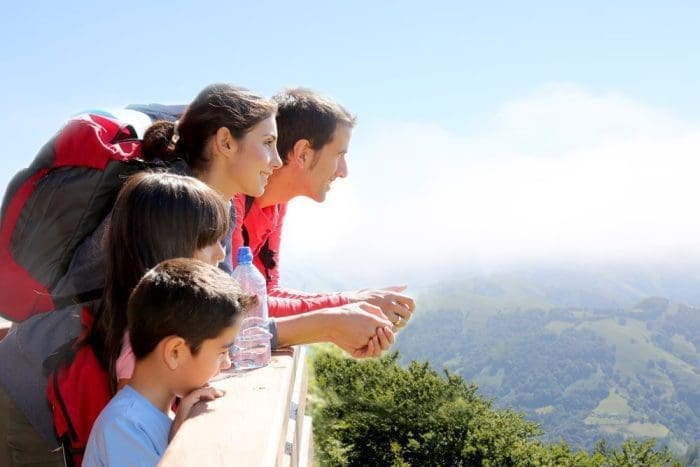 Family on a trek day in the mountain looking at the view