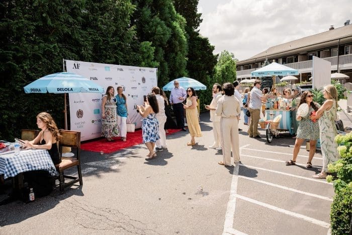 people on red carpet at brunch event in the Hamptons