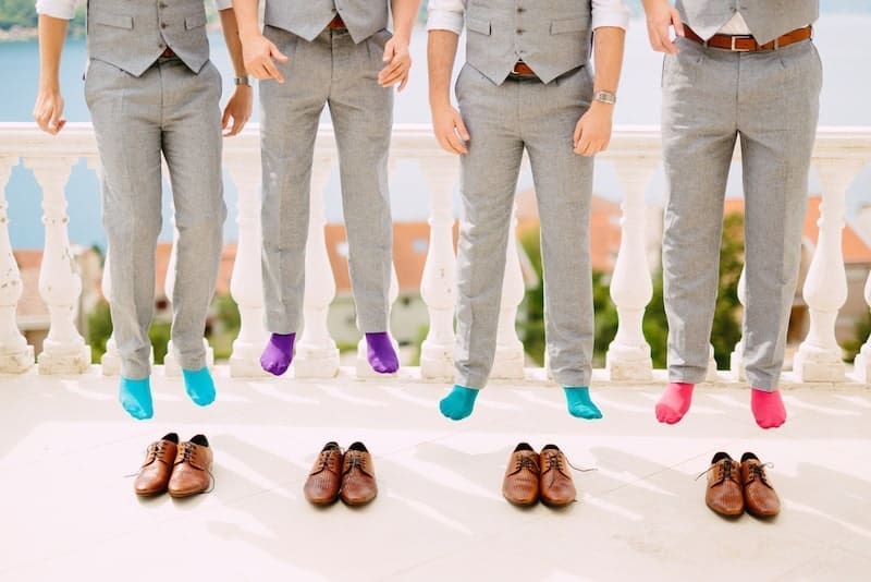 Men in colorful socks. Funny wedding photos