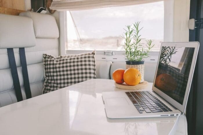 laptop open inside luxury camper van