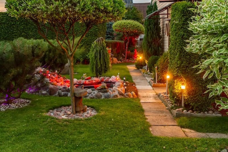 Garden illuminated by lamps