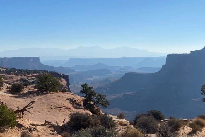 mountains in distance blue sky cliffs