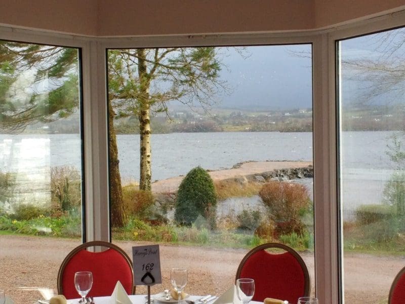 Harvey's Point ireland view outside red chairs