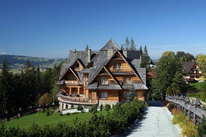 beautiful house in the mountains and blue sky