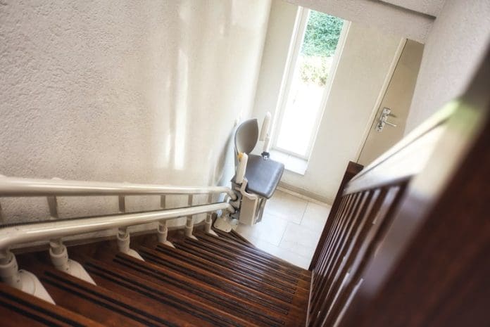 Automatic stairlift on staircase for elderly or disability