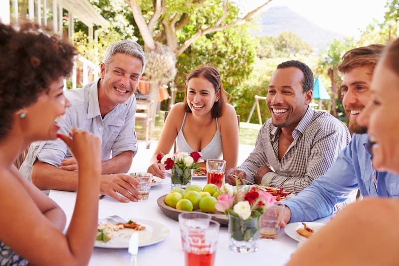 Couple Dining Al Fresco, Toasting Each Other