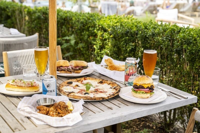 al fresco dining Montauk outdoor wooden table burger beer